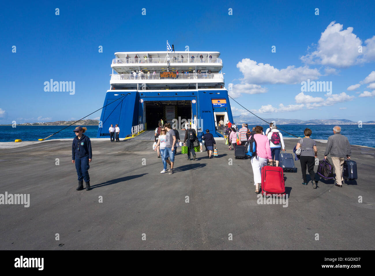 Traveller at the Blue Star Ferry,  harbour of Naxos-town, Naxos island, Cyclades, Aegean, Greece Stock Photo