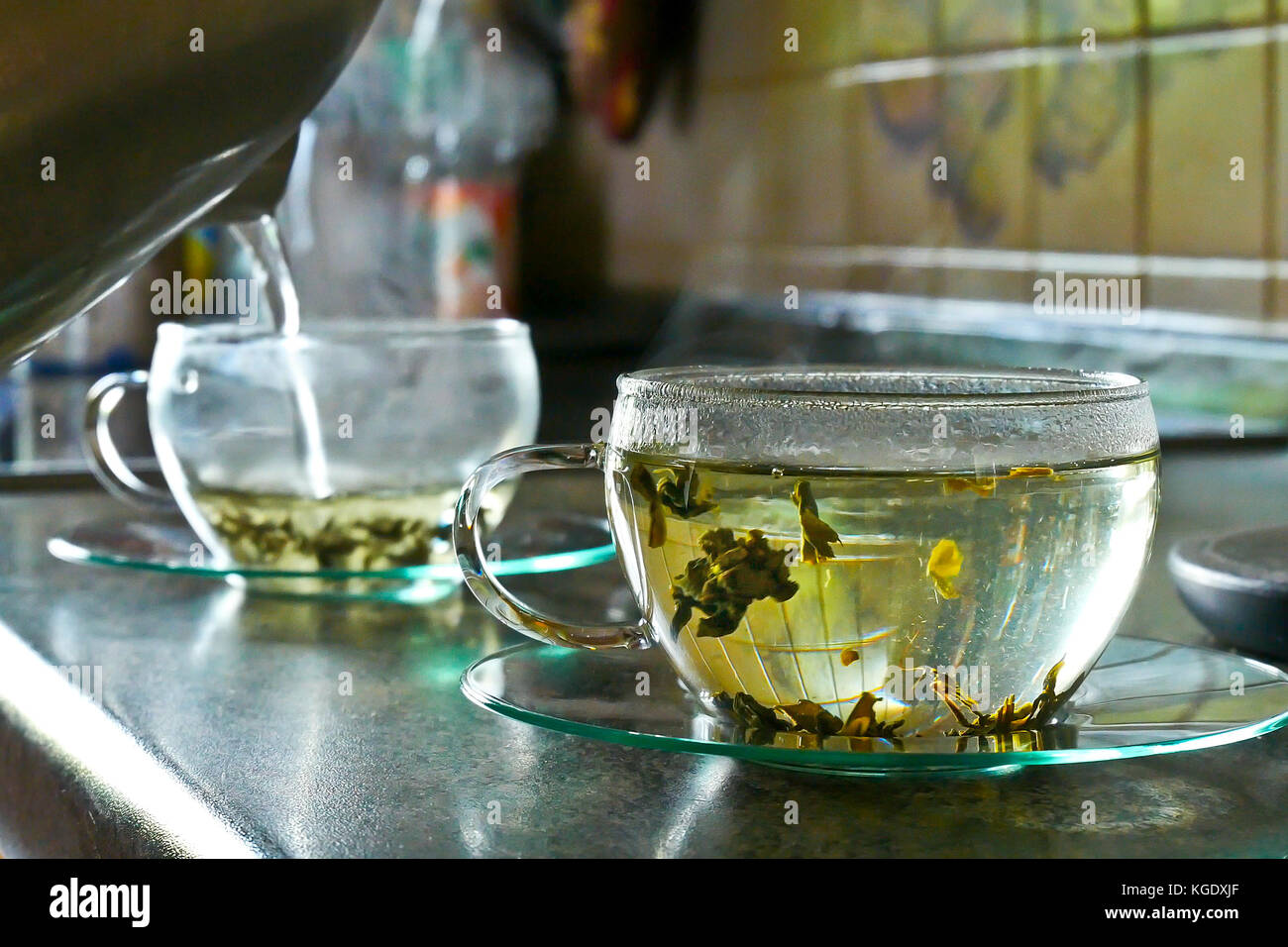 Pouring Hot Water into the Cup of Tea Stock Photo Alamy