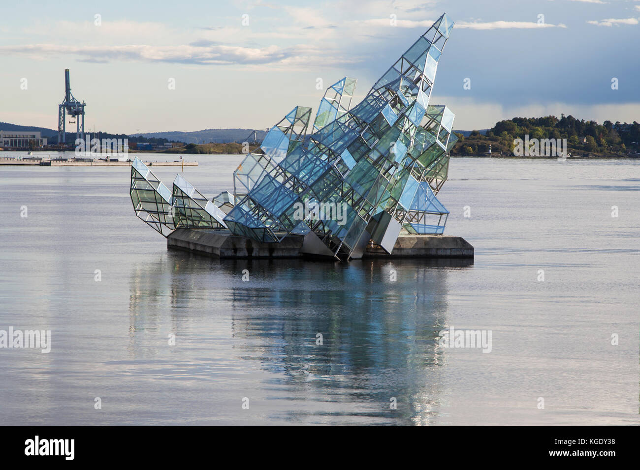 She Lies, sculpture designed by Monica Bonvicini, floating on water next to the Opera House of Oslo, Norway. Stock Photo