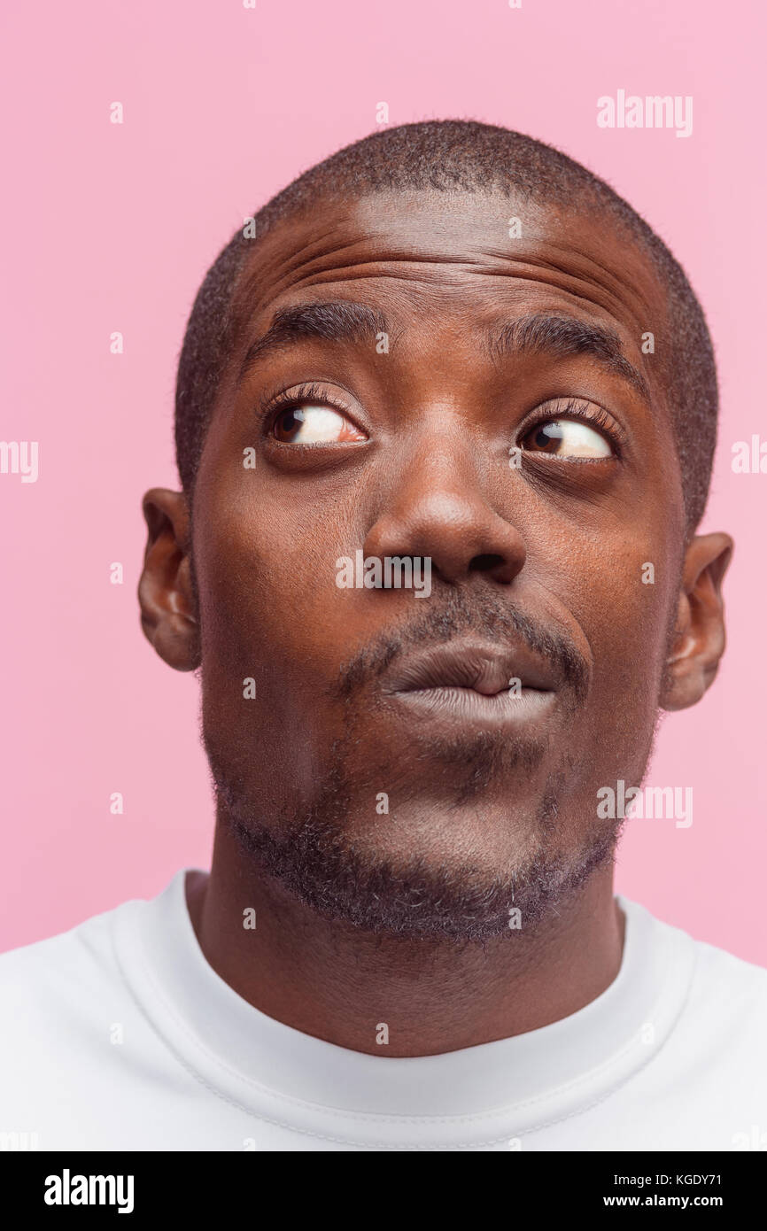 Positive thinking African-American man on pink background Stock Photo