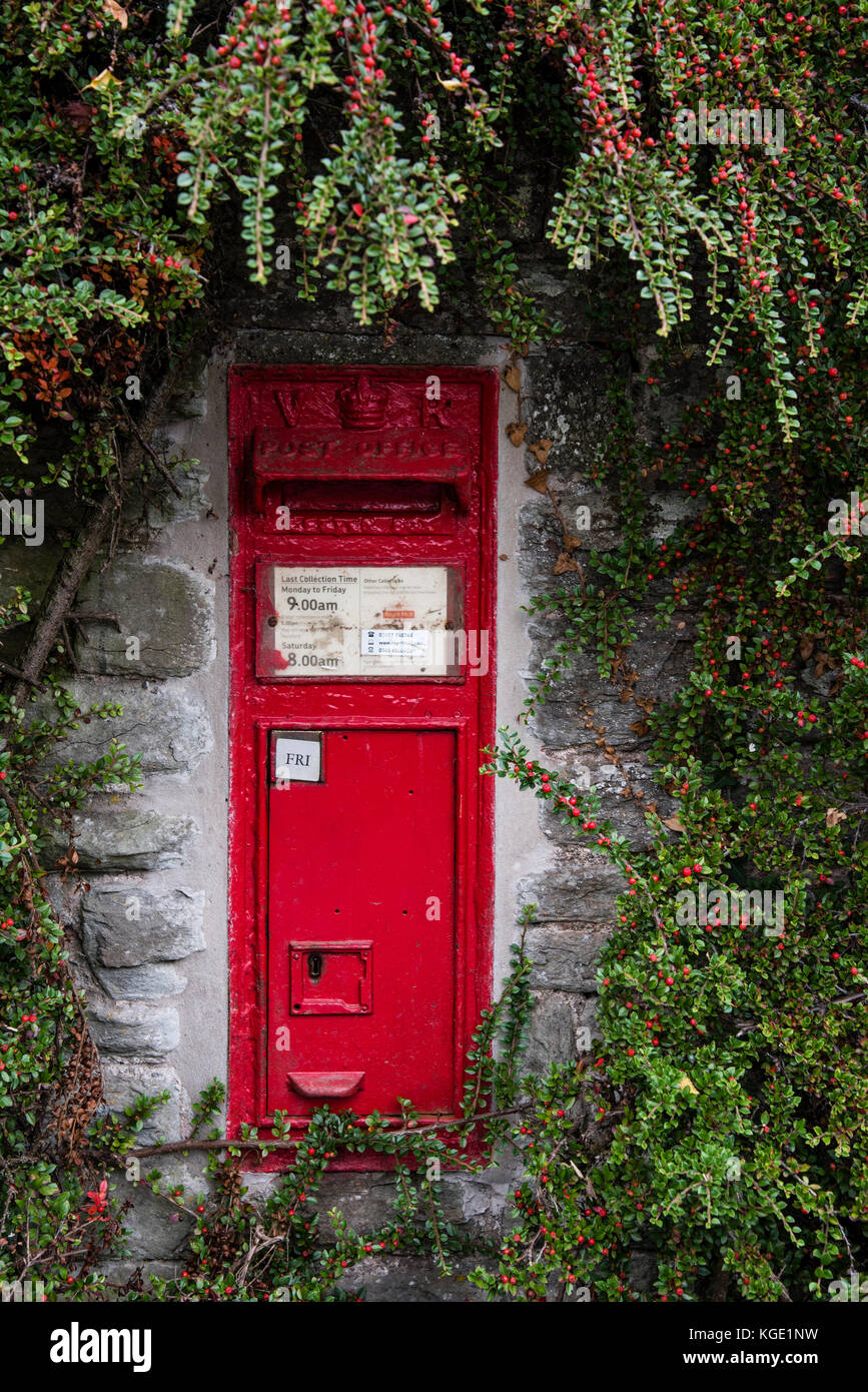 A traditional Royal Mail post box, dating from Queen Victoria. Stock Photo