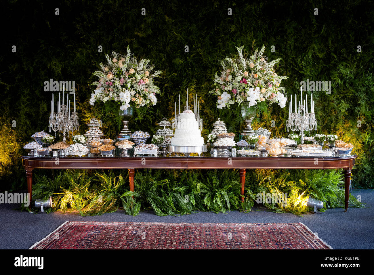 An elegant and impressive cake and candy table for a wedding Stock