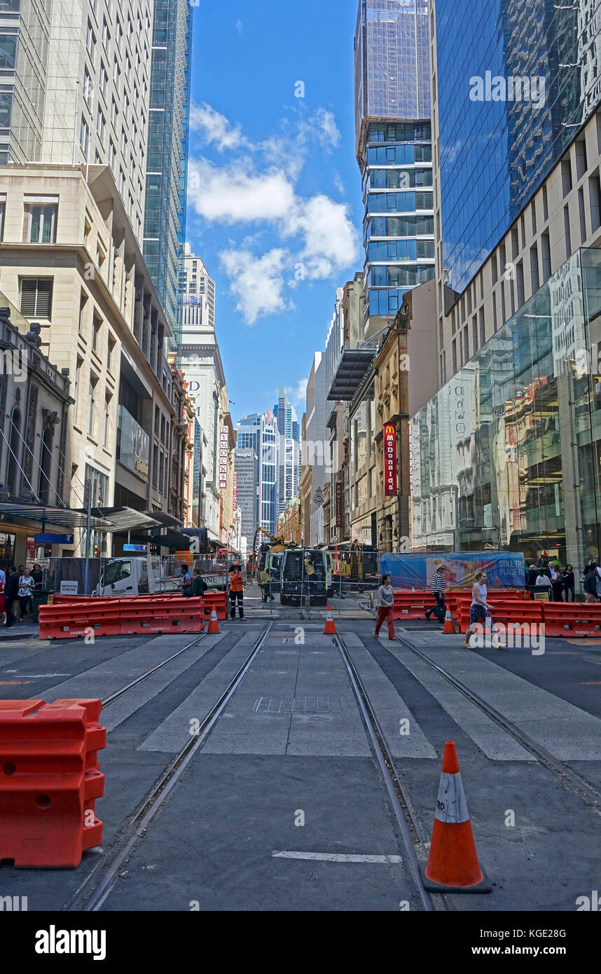 Construction work laying steel rail tracks along George Street in Sydney's CBD (central business district) for the 12km South East Light Rail route Stock Photo