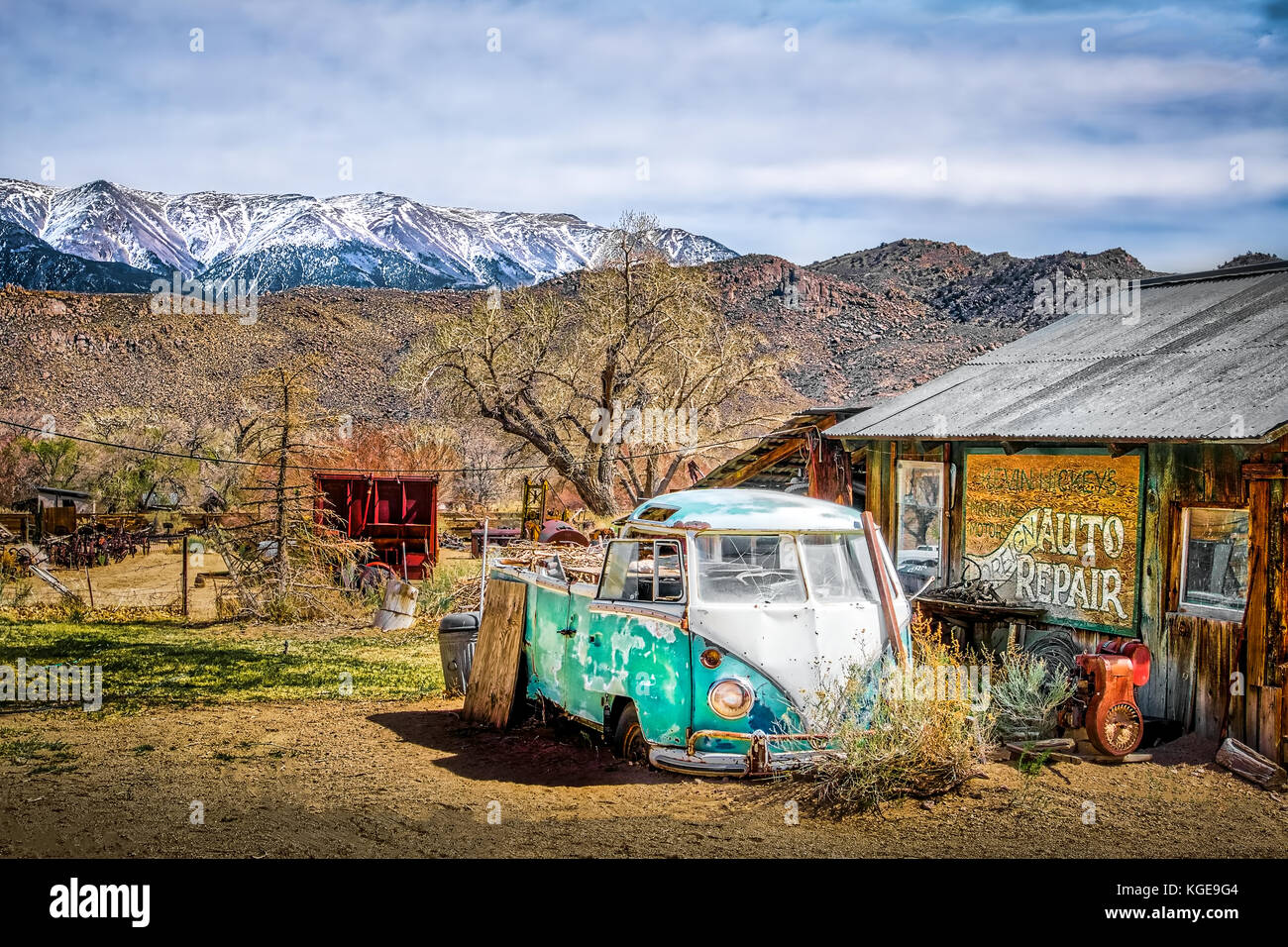 A vehicle sits in disrepair outside an abandoned repair shop in Benton Hot Springs, California, U.S.A. Stock Photo