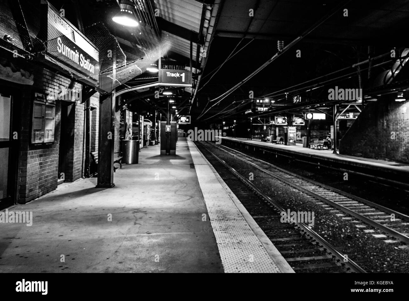 Summit, NJ USA - November 1, 2017:  Empty train station at night, black and white Stock Photo