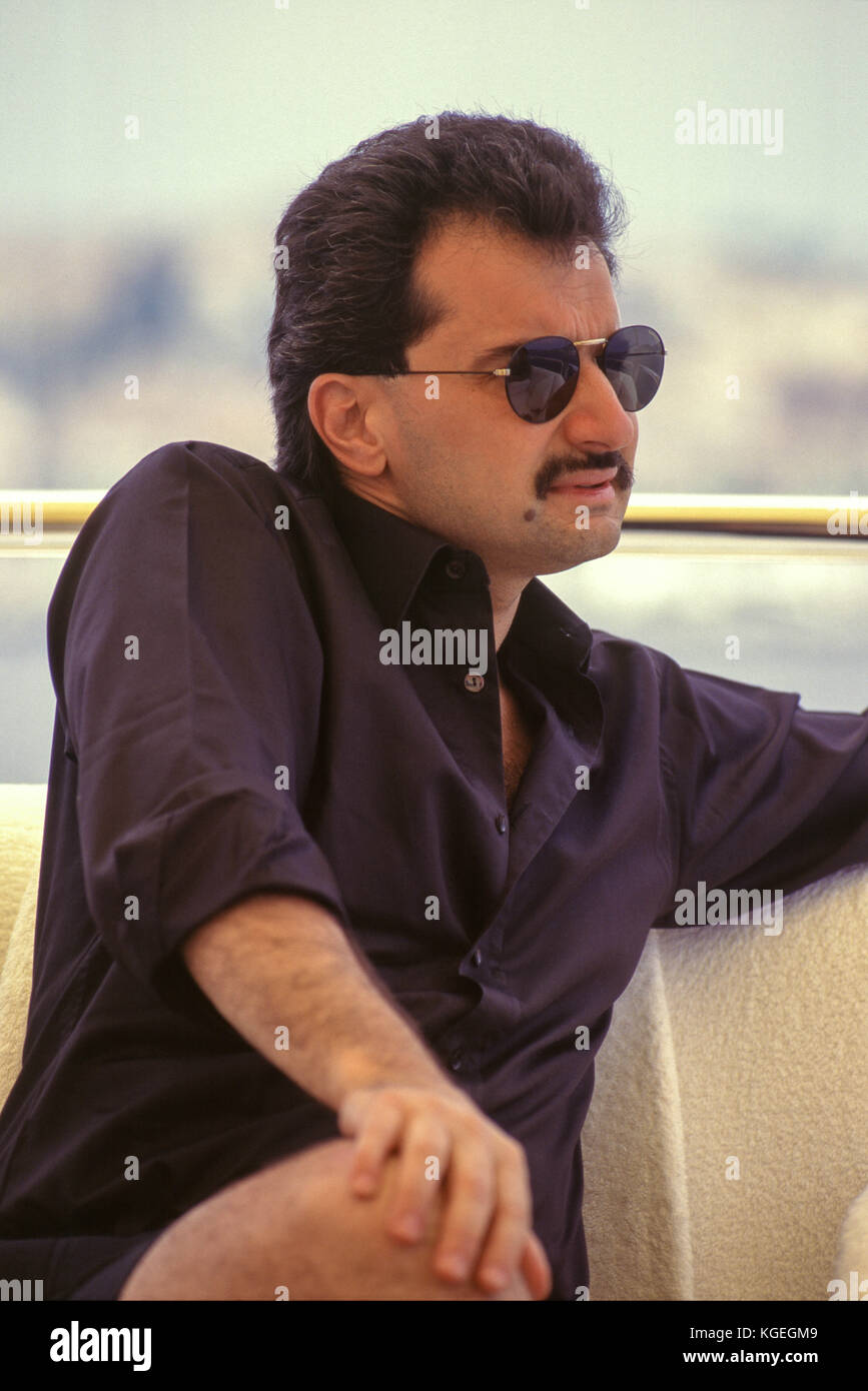 Saudi prince Al-Waleed Bin Talal bin Abdulaziz al Saud, businessman, investor and philanthropist, and member of the Saudi royal family, on summer holiday with children on board his "Kingdom 5KR" 85-meter yacht, bought "Trump Princess" from Donald Trump in the 1980s during his financial problems, who had in turn bought "Nabila"  from Saudi arms dealer Khashoggi, during which time it appeared as the Flying Saucer in James Bond's "Never Say Never Again", in Nice, France in 1997.  Al-Waleed was arrested November 4th, 2017 in an anti-corruption drive that included at least 10 other princes, four mi Stock Photo
