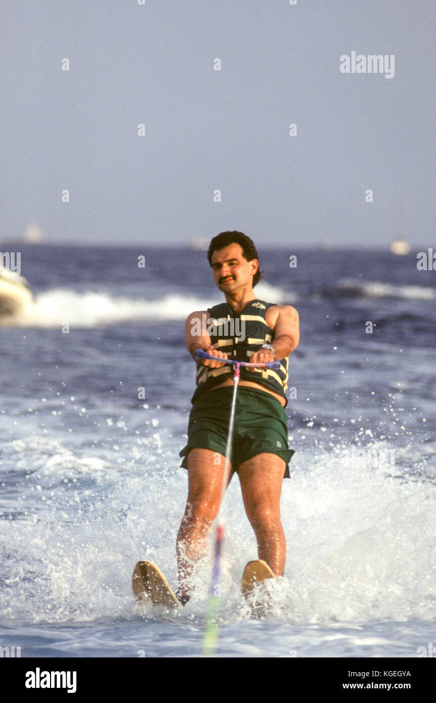 Saudi prince Al-Waleed Bin Talal bin Abdulaziz al Saud, businessman, investor and philanthropist, and member of the Saudi royal family, on summer holiday with children on board his 'Kingdom 5KR' 85-meter yacht, bought 'Trump Princess' from Donald Trump in the 1980s during his financial problems, who had in turn bought 'Nabila'  from Saudi arms dealer Khashoggi, during which time it appeared as the Flying Saucer in James Bond's 'Never Say Never Again', in Nice, France in 1997.  Al-Waleed was arrested November 4th, 2017 in an anti-corruption drive that included at least 10 other princes, four mi Stock Photo