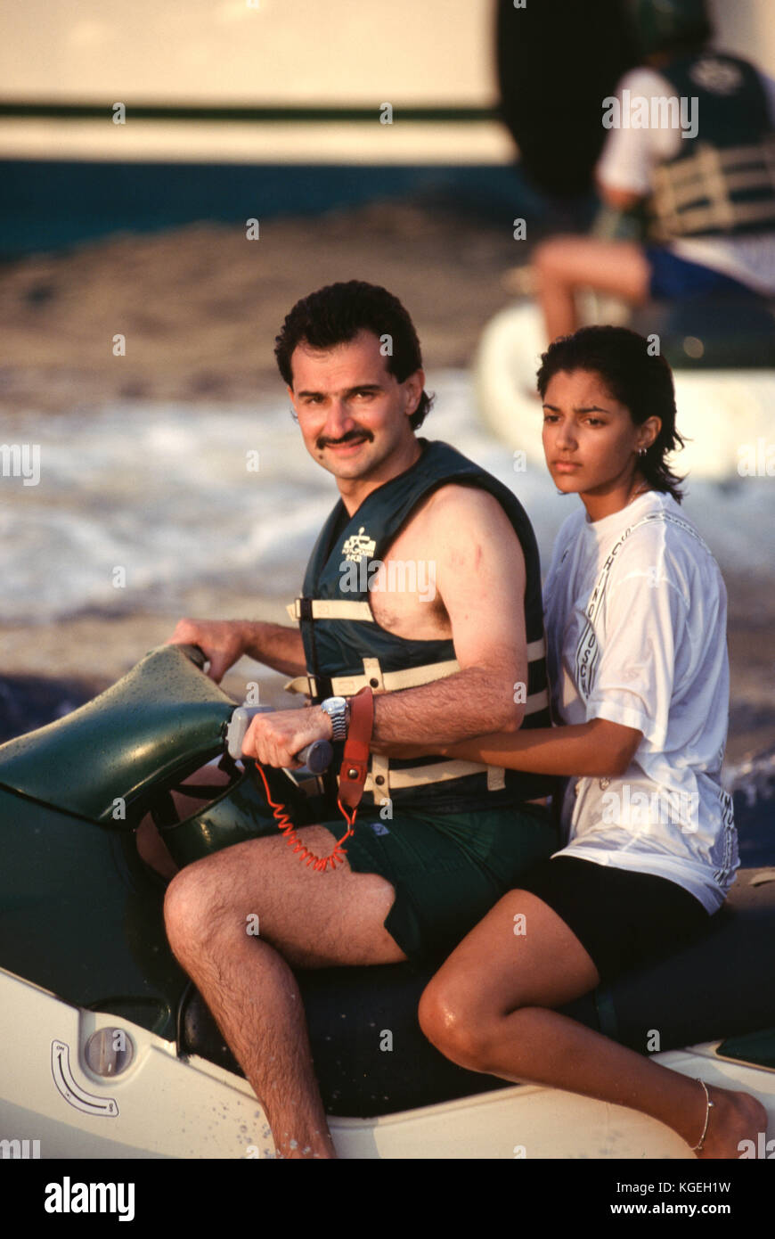 Saudi prince Al-Waleed Bin Talal bin Abdulaziz al Saud, businessman, investor and philanthropist, and member of the Saudi royal family, on summer holiday with children on board his "Kingdom 5KR" 85-meter yacht, bought "Trump Princess" from Donald Trump in the 1980s during his financial problems, who had in turn bought "Nabila"  from Saudi arms dealer Khashoggi, during which time it appeared as the Flying Saucer in James Bond's "Never Say Never Again", in Nice, France in 1997.  Al-Waleed was arrested November 4th, 2017 in an anti-corruption drive that included at least 10 other princes, four mi Stock Photo