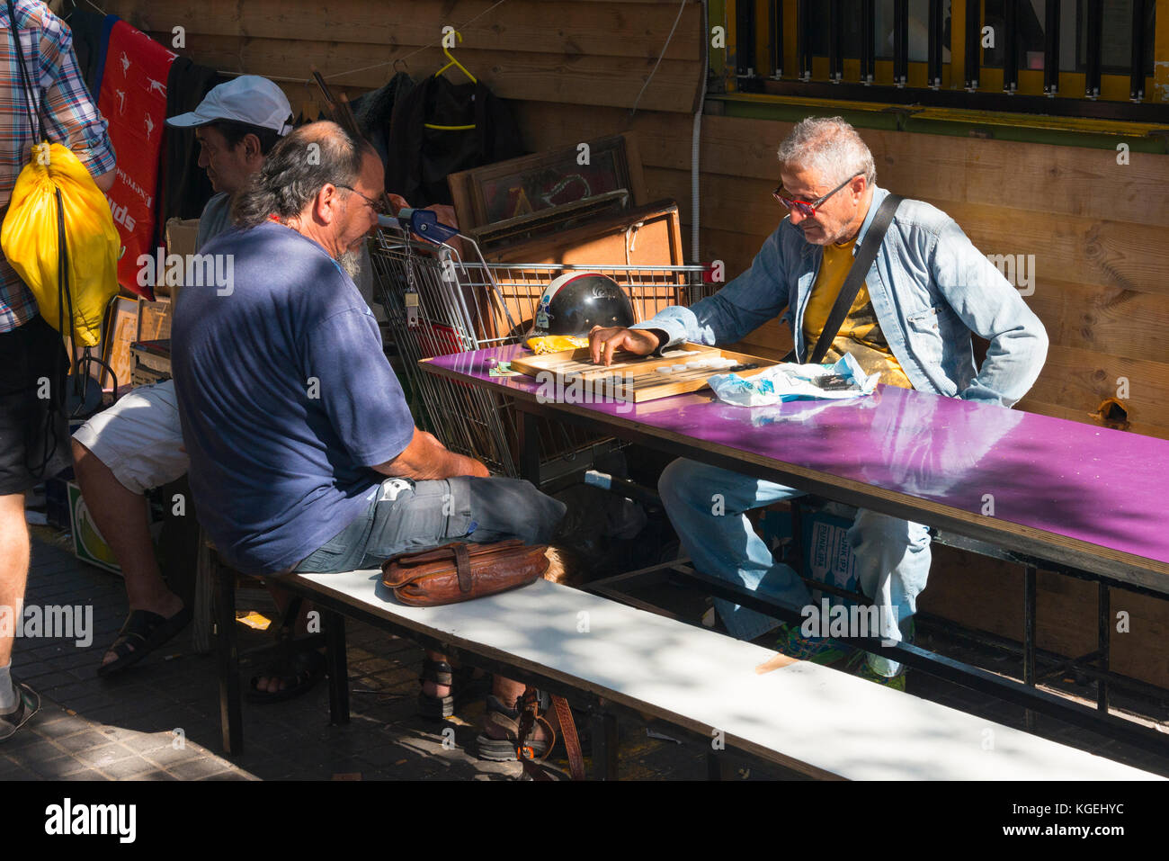 Israel The Holy Land Tel Aviv Jaffa Yafo flea market cafe bar wooden shed benches seats customers drinks glasses two old men playing backgammon Stock Photo