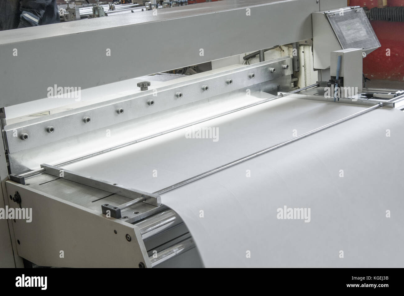 closeup of the machine and equipment are cut and furrowing the felt fabric for automotive filters Stock Photo