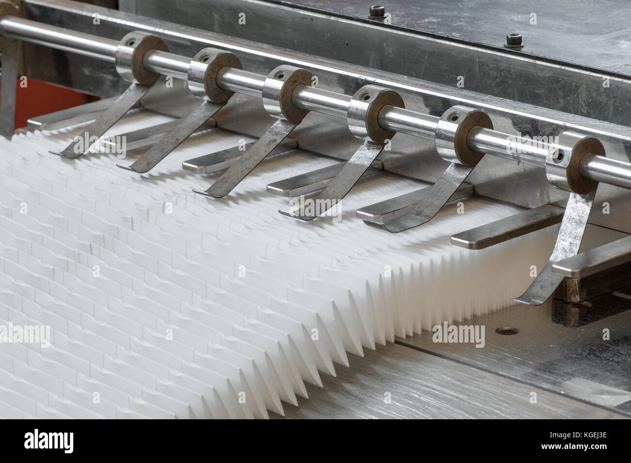 closeup of the machine and equipment are cut and furrowing the felt fabric for automotive filters Stock Photo