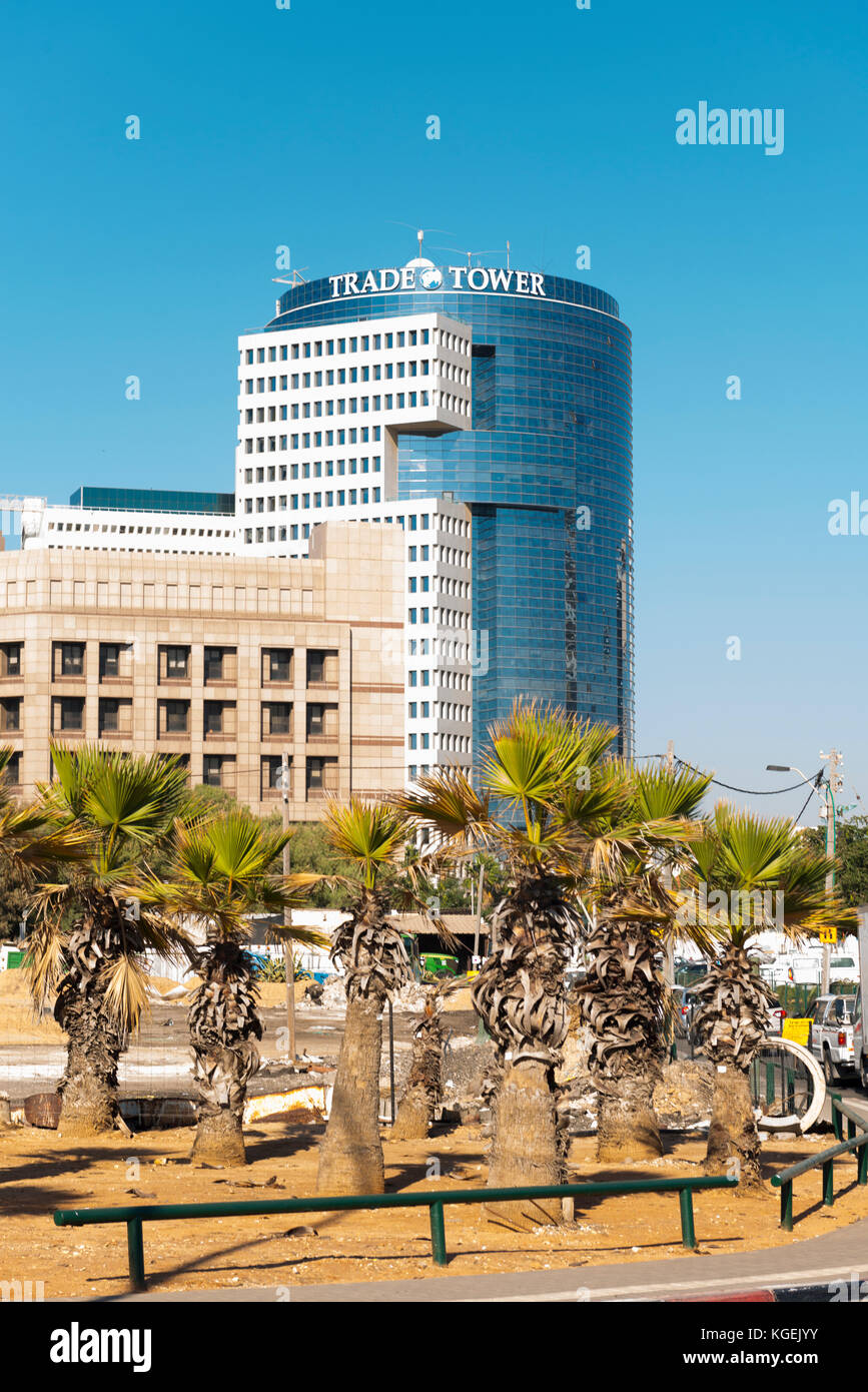 Israel The Holy Land Tel Aviv seafront road Trade Tower centre center modern glass building high-rise skyscraper street scene palm trees building site Stock Photo