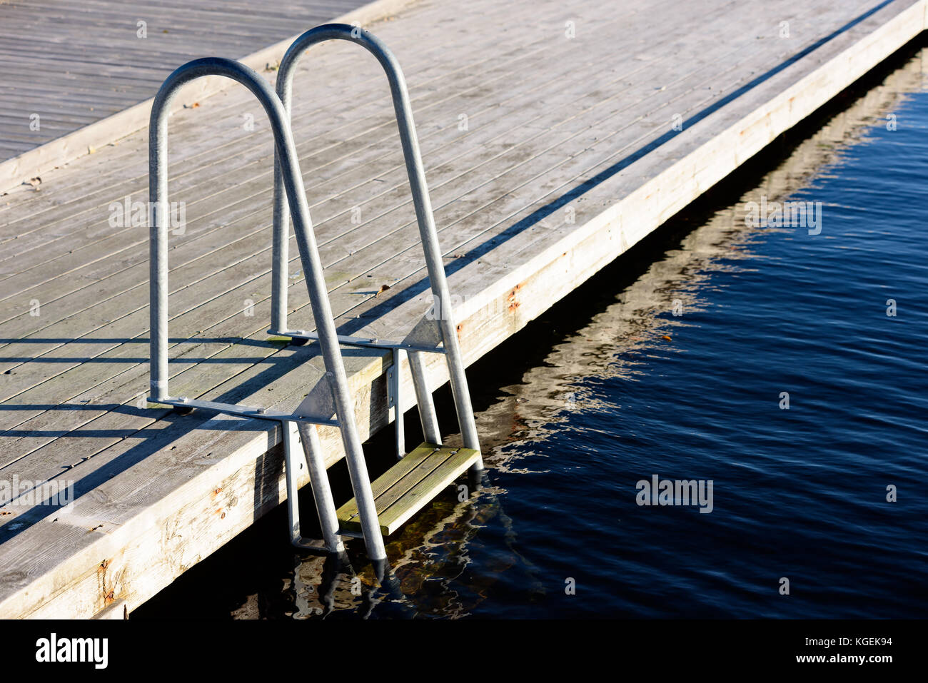 Bathing ladder or swim ladder at wooden outdoor pier Stock Photo Alamy