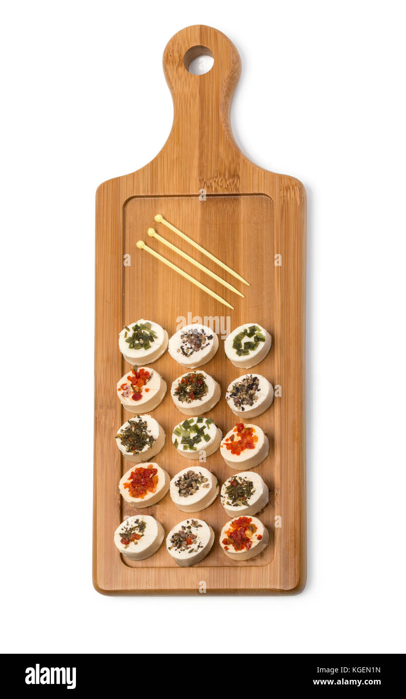 Cheese platter garnished  on rustic wooden board with clipping path Stock Photo