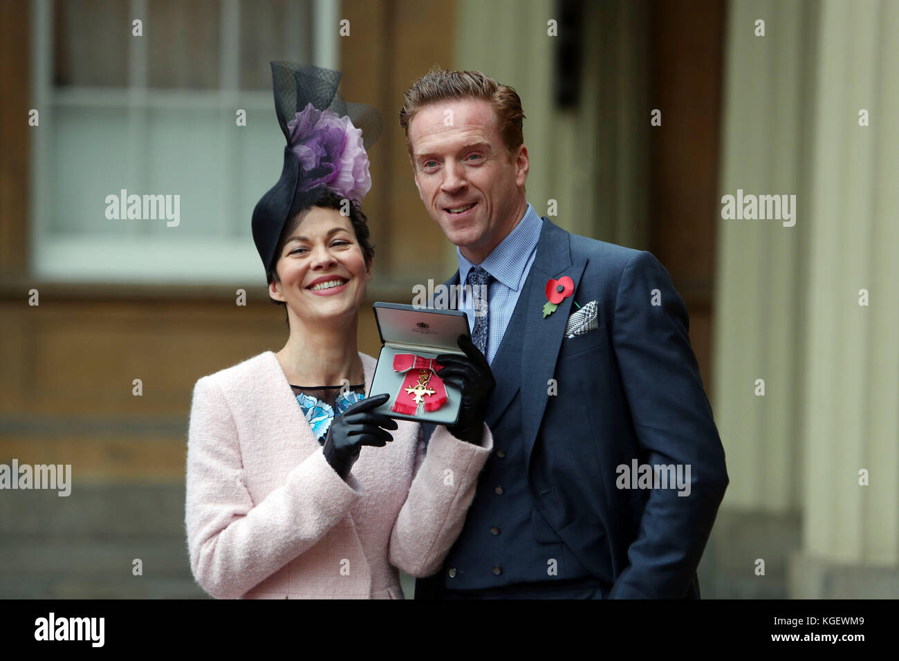 Actor Helen McCrory with husband Damian Lewis after she was awarded an OBE by Queen Elizabeth II at an Investiture ceremony at Buckingham Palace, London. Stock Photo