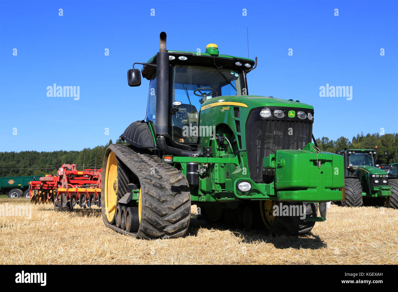 SALO, FINLAND - AUGUST 22, 2015: John Deere 8345RT tracked tractor and Vaderstad cultivator on display at Puontin Peltopaivat Agricultural Harvesting  Stock Photo