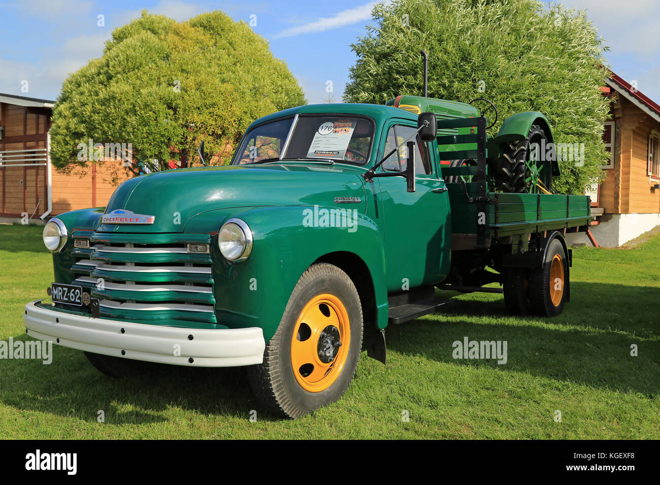 ALAHARMA, FINLAND - AUGUST 8, 2015: Classic Chevrolet 6400 Pickup truck year 1952 and Oliver Standard 70 Agricultural Tractor year 1938 in Power Truck Stock Photo
