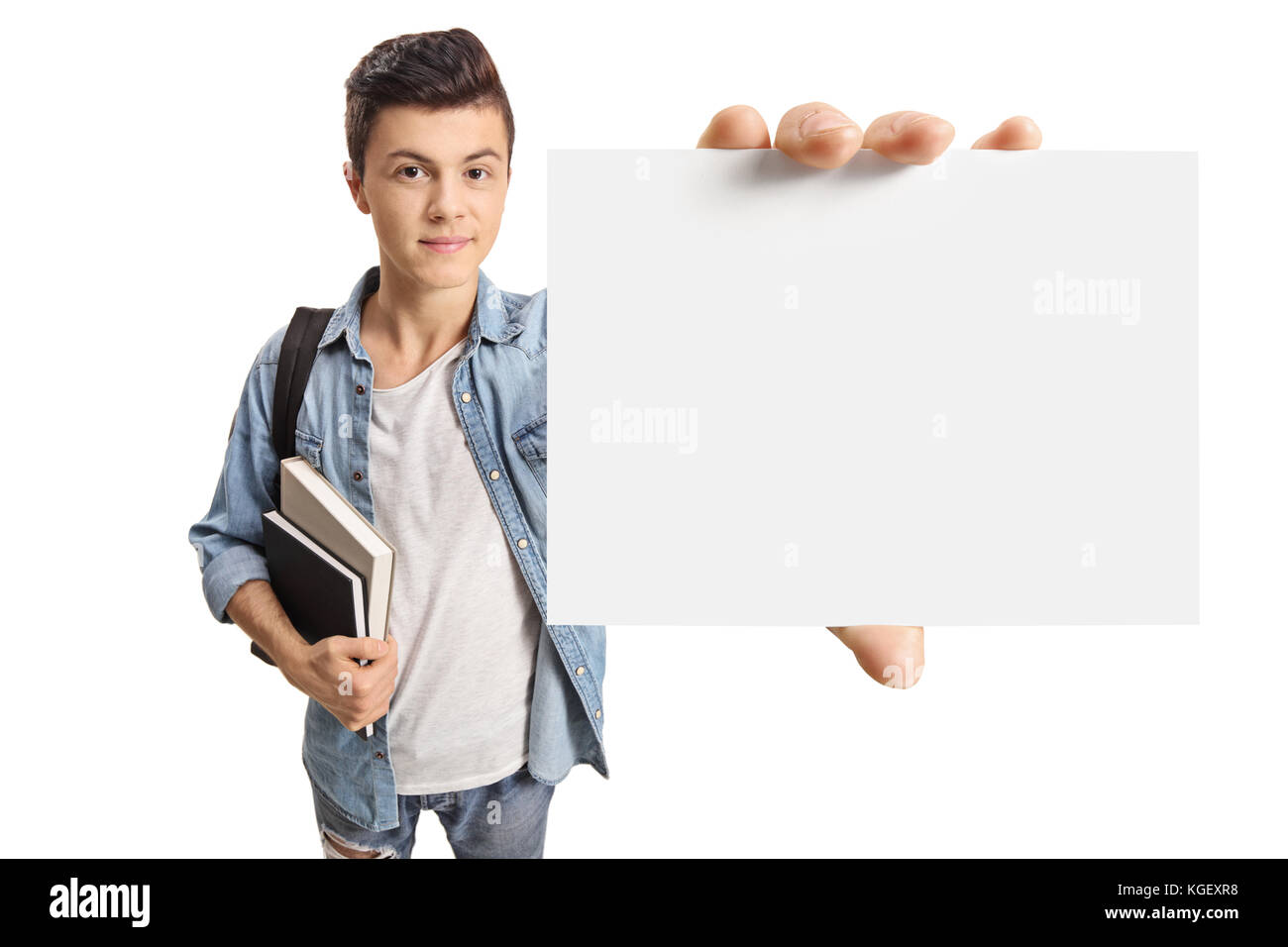 Teenage student showing a blank card isolated on white background Stock Photo