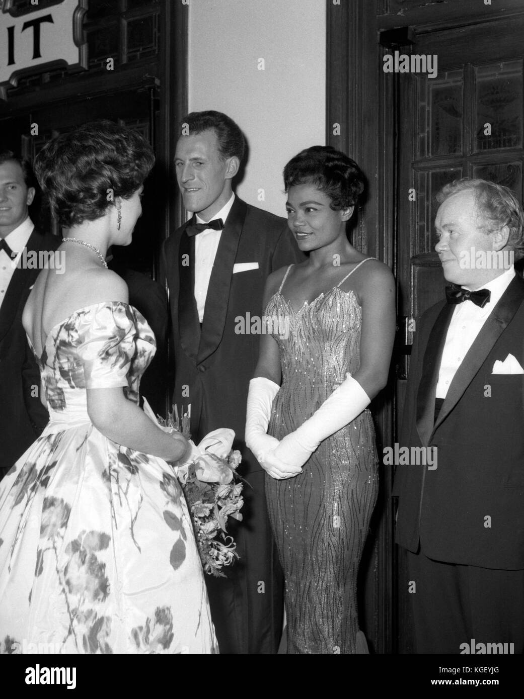 Queen Elizabeth II with singer Eartha Kitt and other performers after the Royal Variety Show at the London Coliseum. Entertainer Bruce Forsyth is on the left. Stock Photo