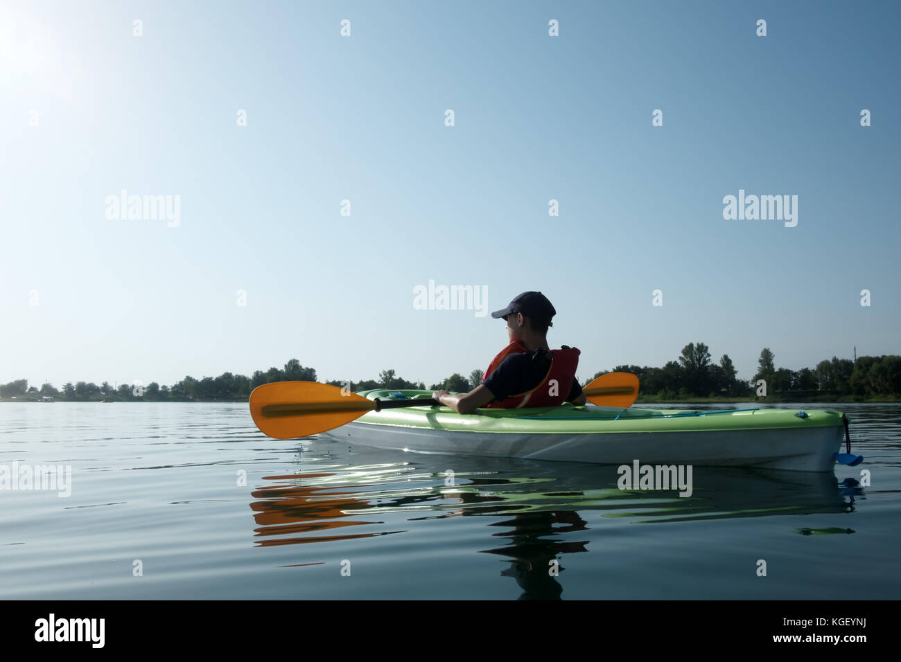 Boy in life jacket on green kayak Stock Photo Alamy