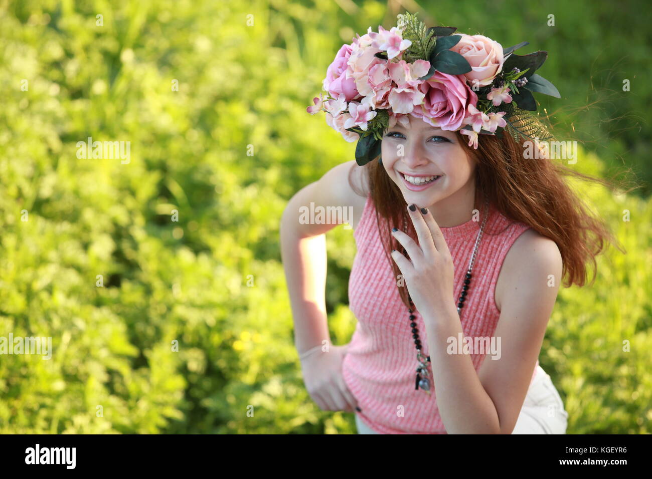 Woman wearing a floral crown hi-res stock photography and images