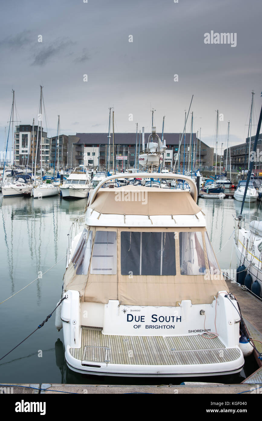 Luxury motor and sailing boats moored for winter in the marina harbour