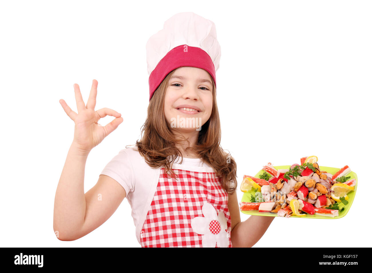 happy little girl cook with seafood and ok hand sign Stock Photo