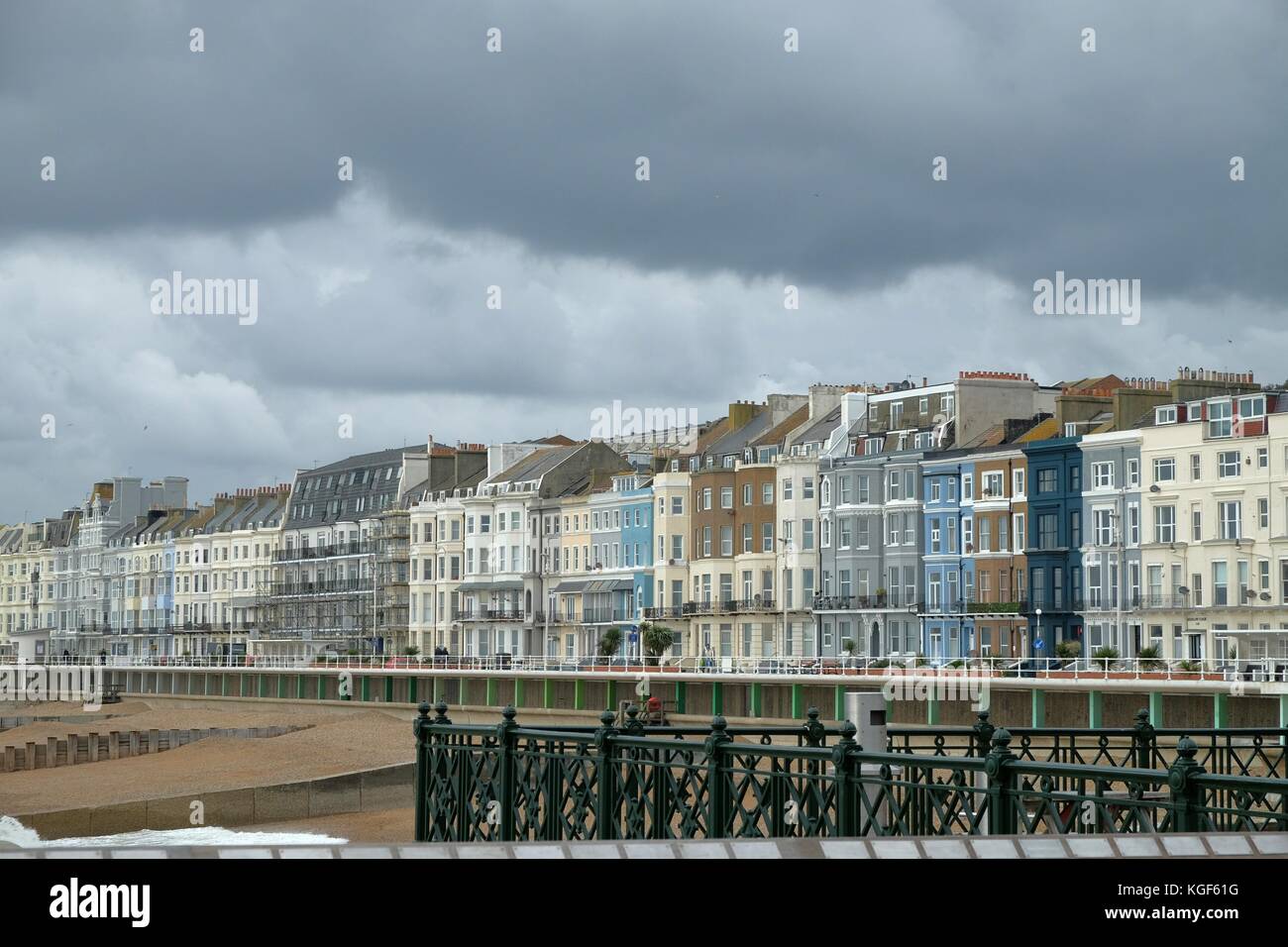 A row of colourful victorian terraced houses in Hastings under moody