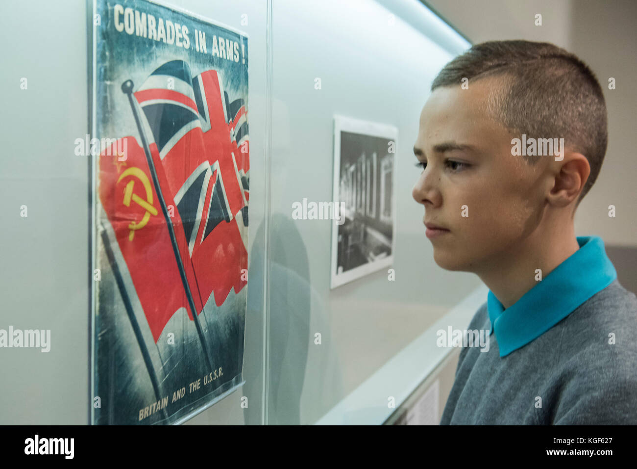 London, UK. 7th Nov, 2017. Comrades in arms - Pupils from Thomas Tallis School in Kidbrooke who are doing Russian studies, visit the exhibition - Tate Modern's new exhibition Red Star Over Russia on the 100th anniversary of the October Revolution. The exhibition offers a visual history of the Soviet Union, revealing how seismic political events inspired a wave of innovation in art and graphic design. Featuring over 250 posters, paintings and photographs, many on public display for the first time. Credit: Guy Bell/Alamy Live News Stock Photo