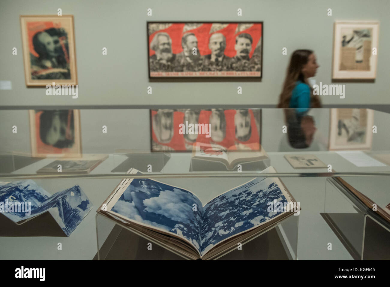London, UK. 7th Nov, 2017. Books by Rodchenko and Raise high the banner of Marx Engel, Lenin and Stalin, 1933 by Gustave Klutsis. Tate Modern's new exhibition Red Star Over Russia on the 100th anniversary of the October Revolution. The exhibition offers a visual history of the Soviet Union, revealing how seismic political events inspired a wave of innovation in art and graphic design. Featuring over 250 posters, paintings and photographs, many on public display for the first time. Credit: Guy Bell/Alamy Live News Stock Photo