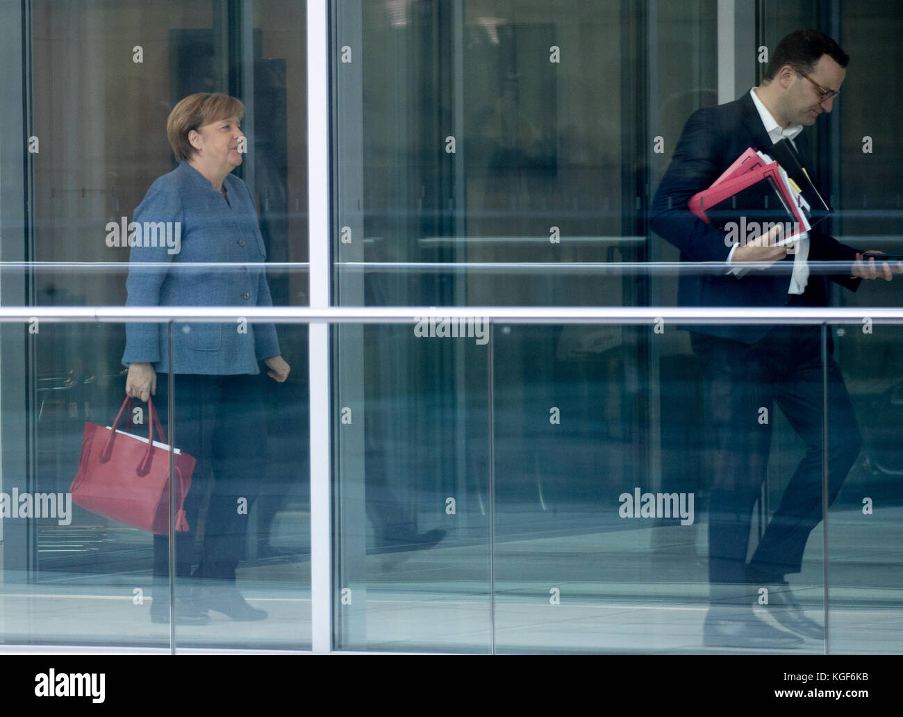 Berlin, Germany. 07th Nov, 2017. German Chancellor Angela Merkel, along with CDU Vice-Chairman Jens Spahn (R), on her way to ongoing exploratory talks by the CDU, CSU, FDP and Alliance 90/The Greens at the Bundestag (Federal Legislature) in Berlin, Germany, 07 November 2017. Credit: Michael Kappeler/dpa/Alamy Live News Stock Photo