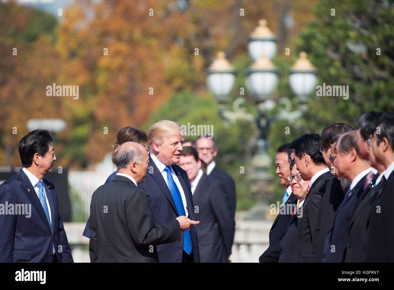 U.S President Donald Trump is introduced to Japanese officials as Japanese Prime Minister Shinzo Abe, left, looks on at the Akasaka Palace November 6, 2017 in Tokyo, Japan. Trump is on a three-day visit to Japan, the first stop of a 13-day swing through Asia. Stock Photo