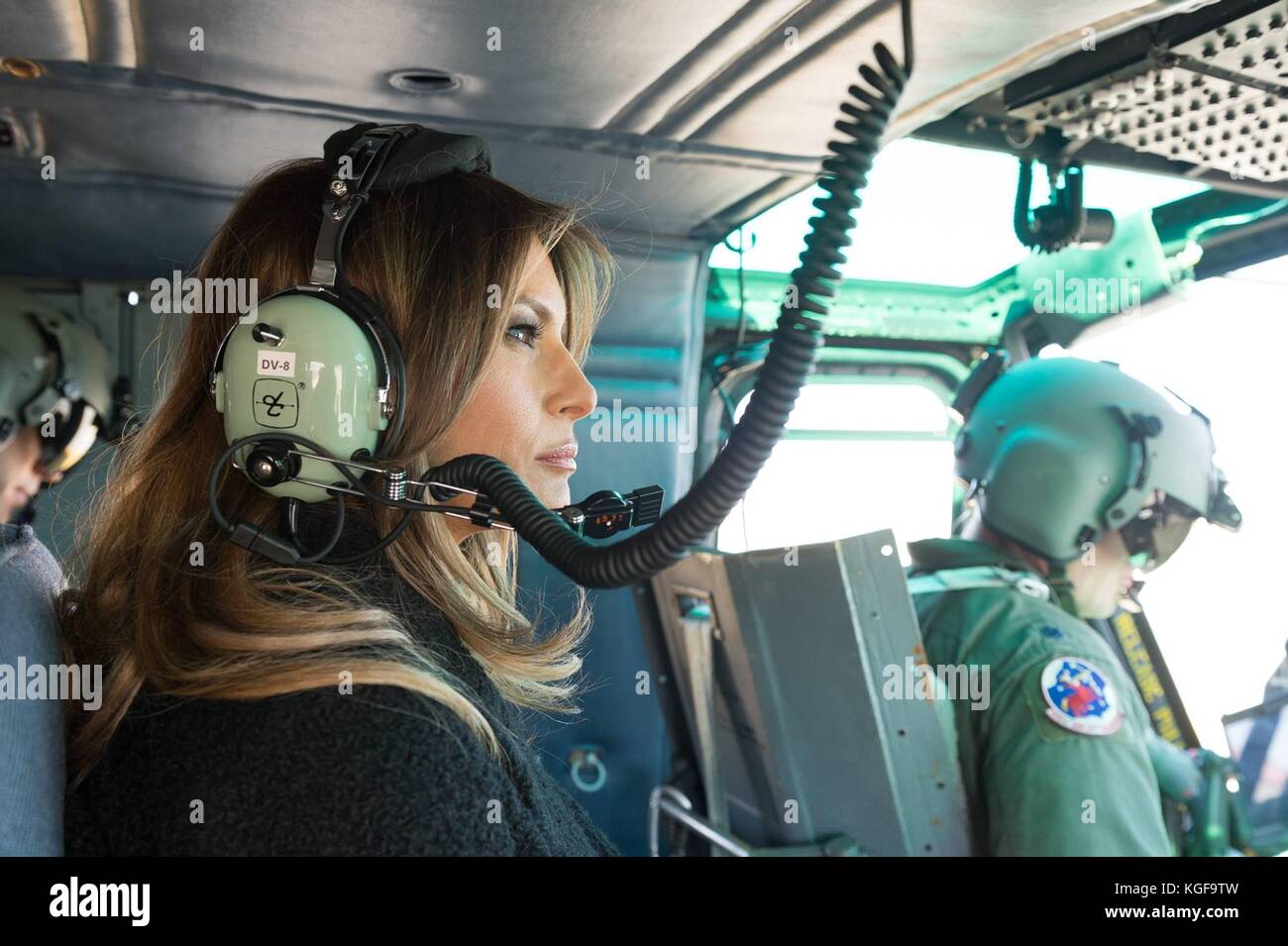 U.S first lady Melania Trump, left, wears headsets during a military helicopter flight from Yokota Air Base to join Akie Abe at the Mikimoto Pearl flagship store in Ginza November 5, 2017 in Tokyo, Japan. Trump is on a three-day visit to Japan, the first stop of a 13-day swing through Asia. Stock Photo