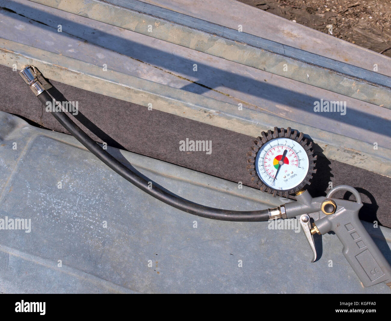 Air compressor tube nozzle with pressure gauge Stock Photo Alamy