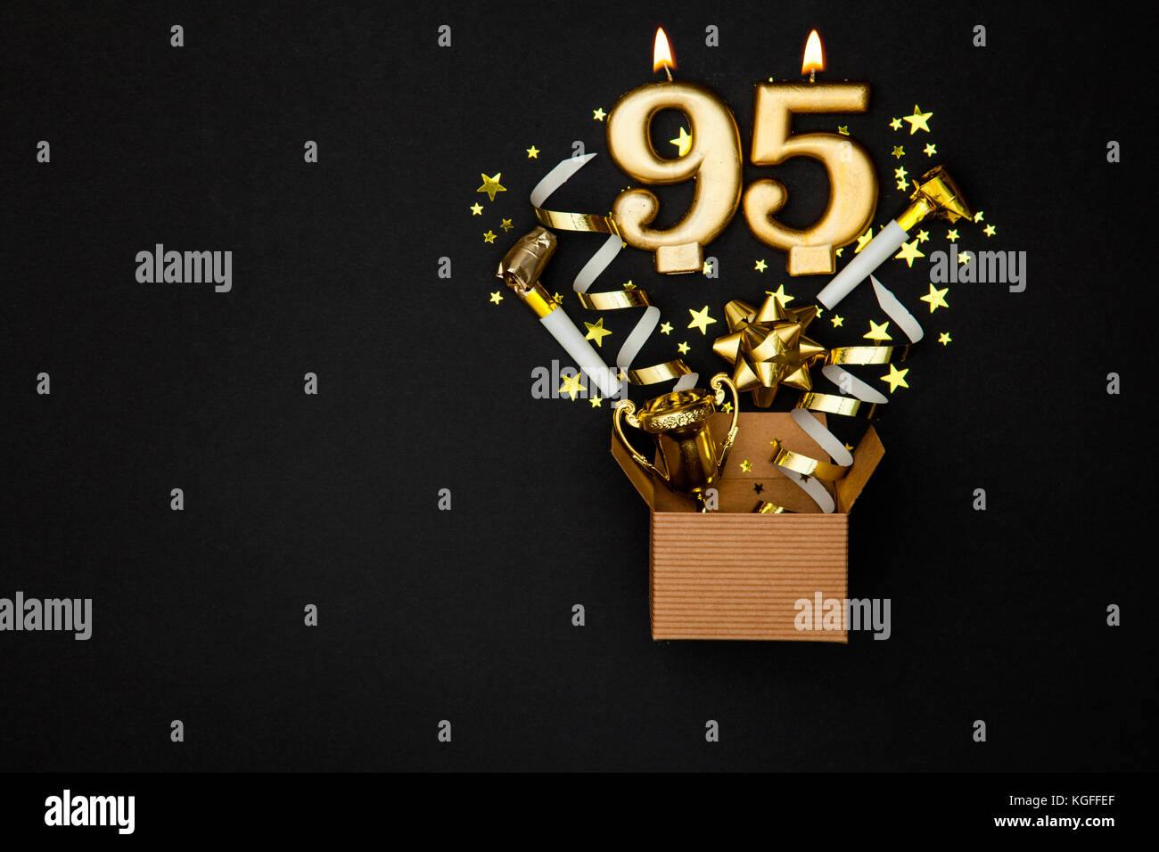 Number 95 gold celebration candle and gift box background ...