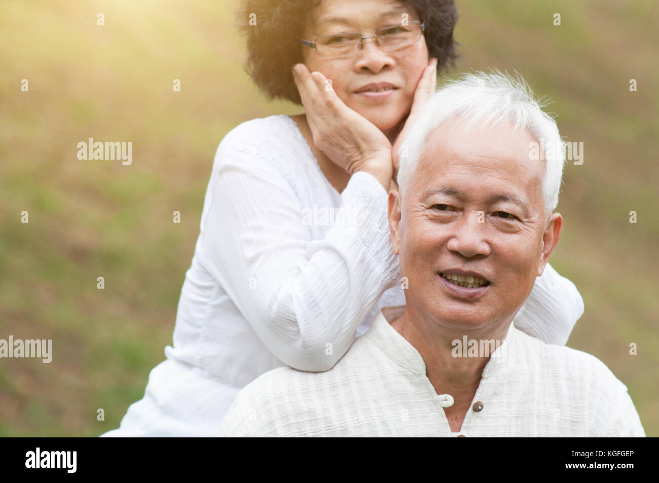 Happy elderly Asian old couple at outdoor park Stock Photo - Alamy