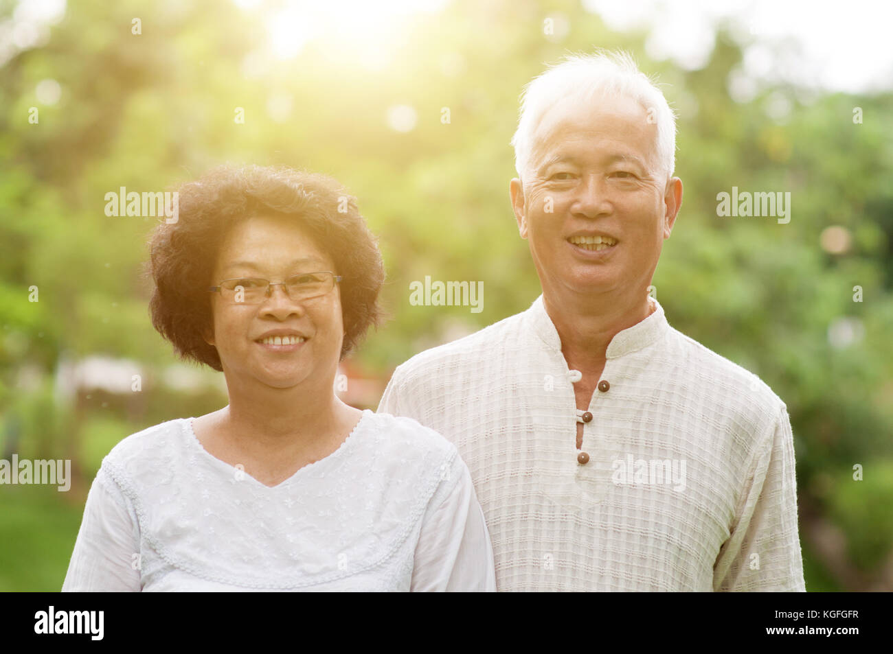 Happy Asian elderly couple smiling at outdoor park Stock Photo - Alamy