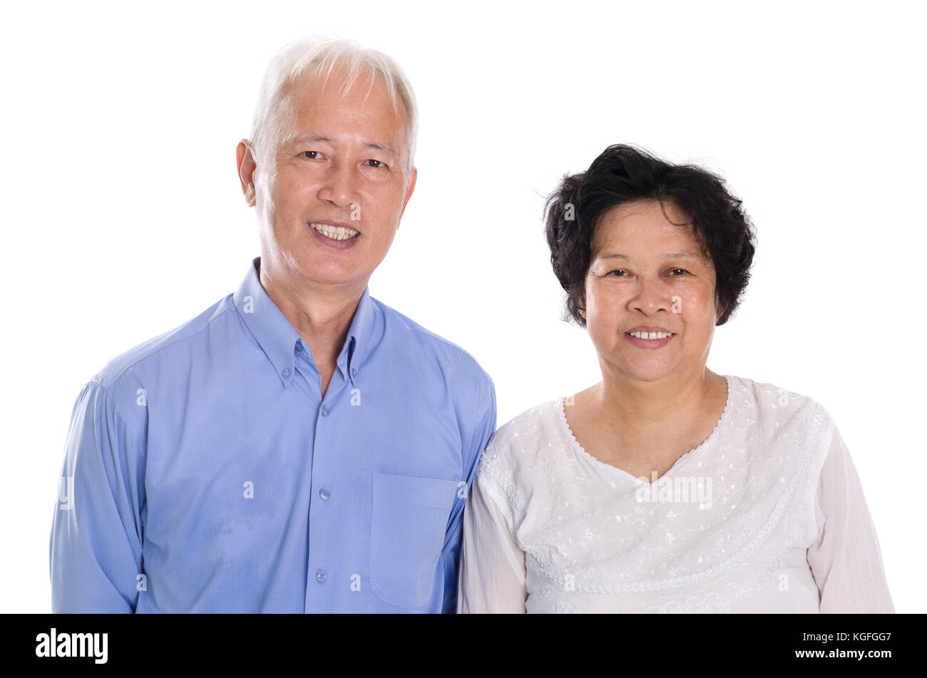 Senior japanese woman looking puzzled, standing over white background Stock...
