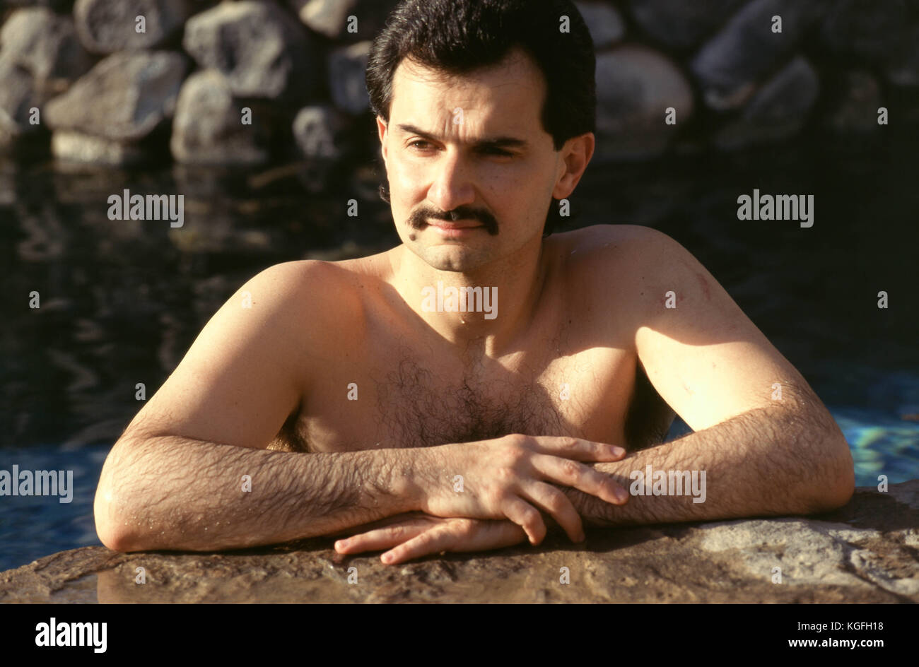 Saudi prince Al-Waleed Bin Talal bin Abdulaziz al Saud, businessman, investor and philanthropist, and member of the Saudi royal family, swimming at his palace in Riyadh in 1997.   Al-Waleed was detained November 4th, 2017 in an anti-corruption drive that included at least 10 other princes, four ministers and tens of former ministers, that sent shock waves through the kingdom and the world's major financial centers. Stock Photo