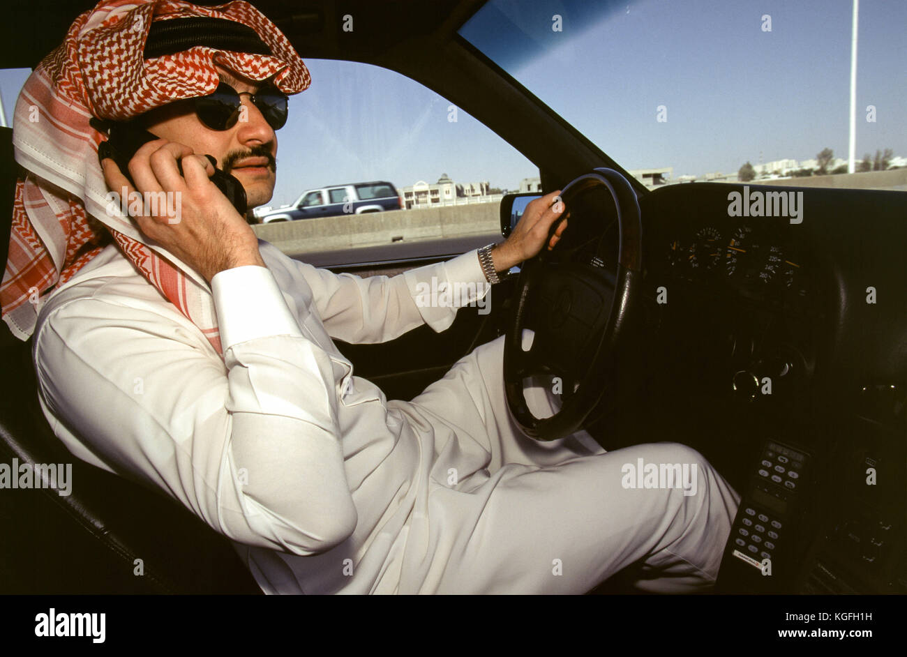 Saudi prince Al-Waleed Bin Talal bin Abdulaziz al Saud, businessman, investor and philanthropist, and member of the Saudi royal family, driving to his palace in Riyadh in 1997.   Al-Waleed was detained November 4th, 2017 in an anti-corruption drive that included at least 10 other princes, four ministers and tens of former ministers, that sent shock waves through the kingdom and the world's major financial centers. Stock Photo