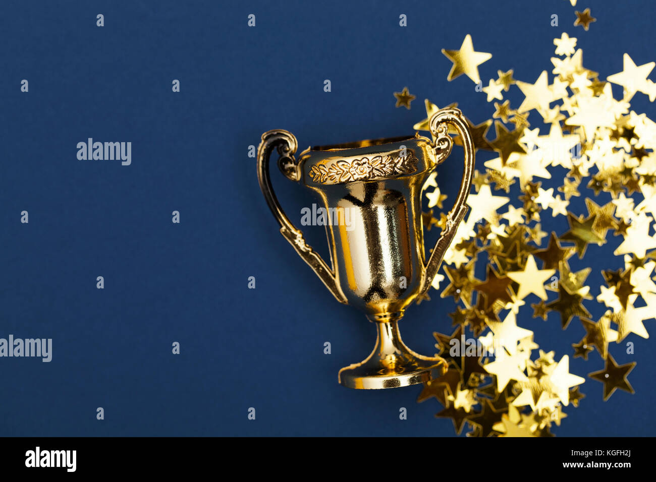 Gold winners achievement trophy background Stock Photo - Alamy