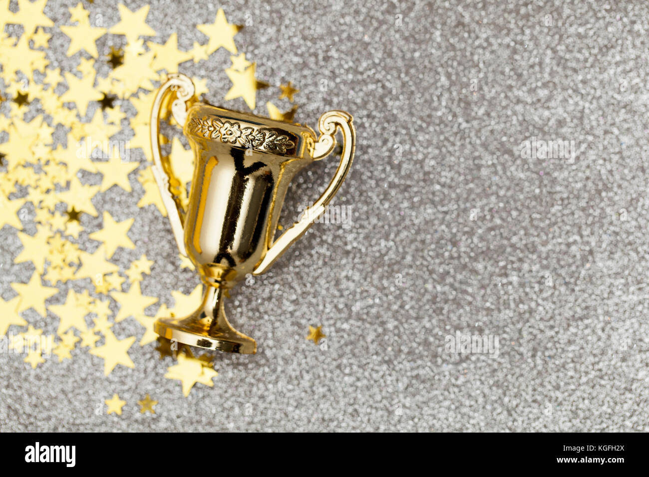 Gold winners achievement trophy background Stock Photo - Alamy