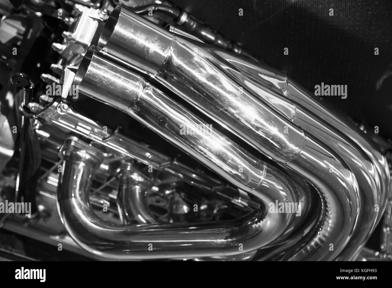 Exhaust pipes. Shiny motor parts, V12 engine fragment, closeup photo with selective focus Stock Photo