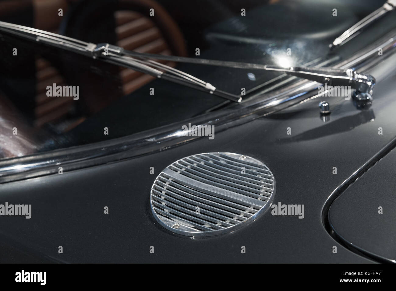 Air intake grille and windscreen wiper. Luxury vintage car fragment, close up photo with selective soft focus Stock Photo