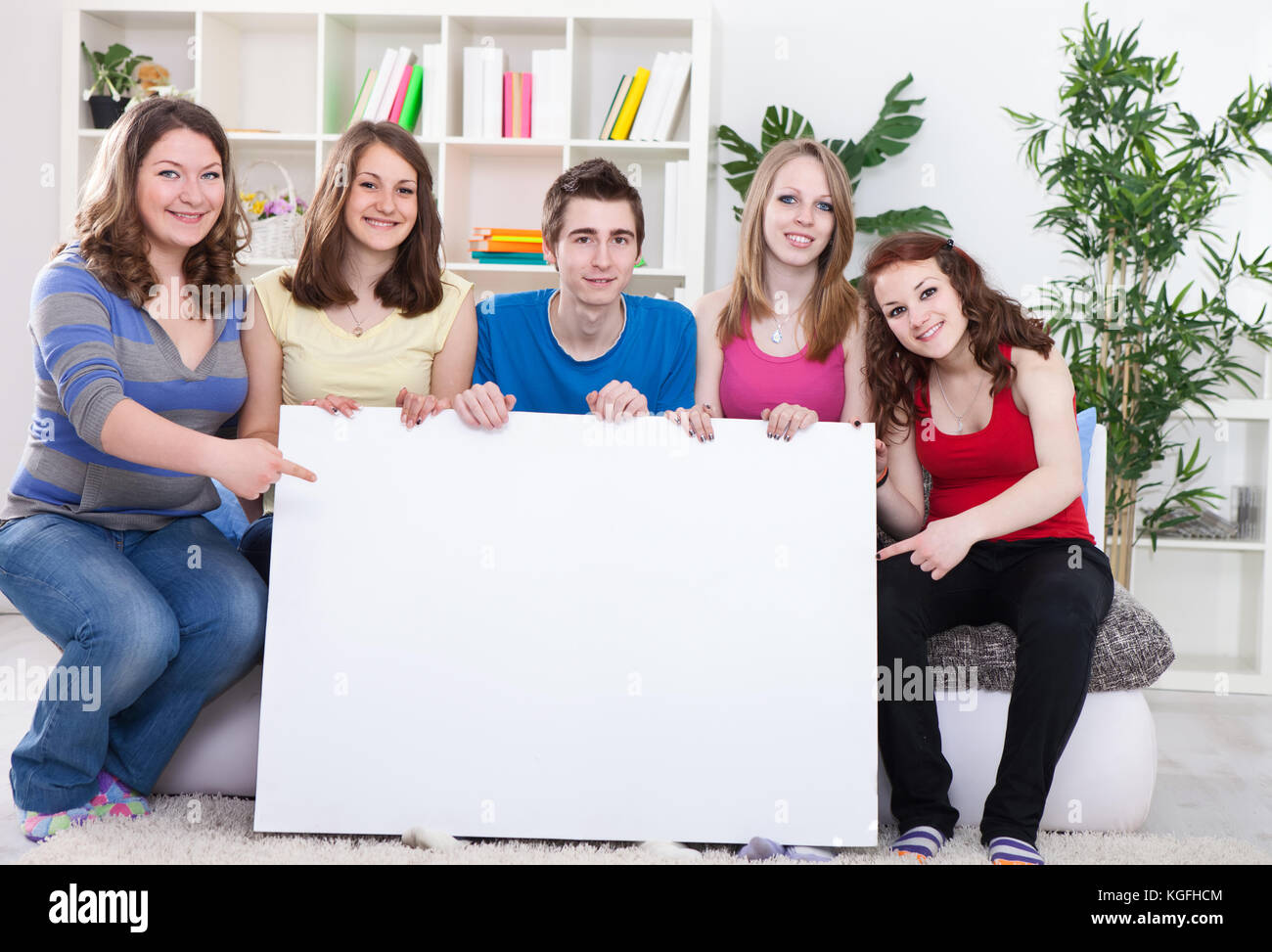 group of young people holding the empty board Stock Photo - Alamy