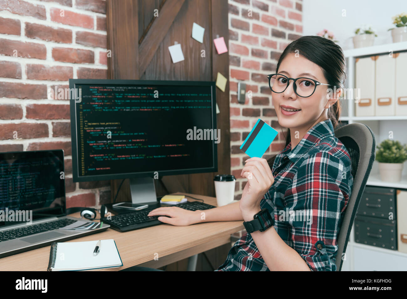 confident pretty programmer design data coding to develop credit card ...
