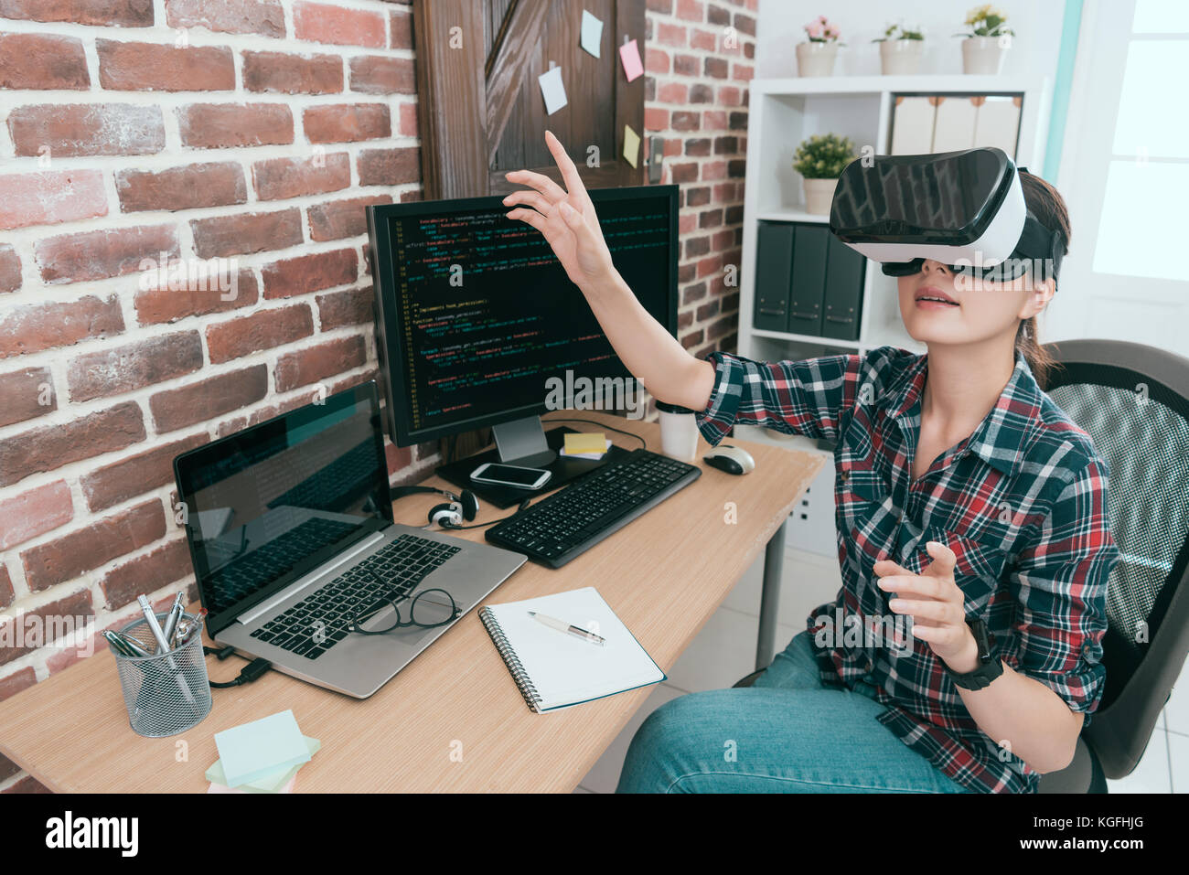 professional young computer programmer wearing VR technology goggles