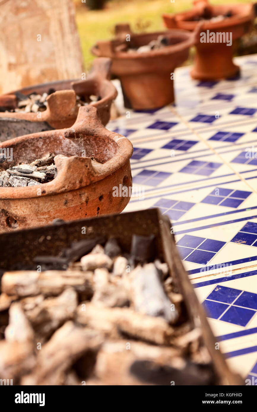 Ceramic dish with embers   for cooking in tajine Stock Photo