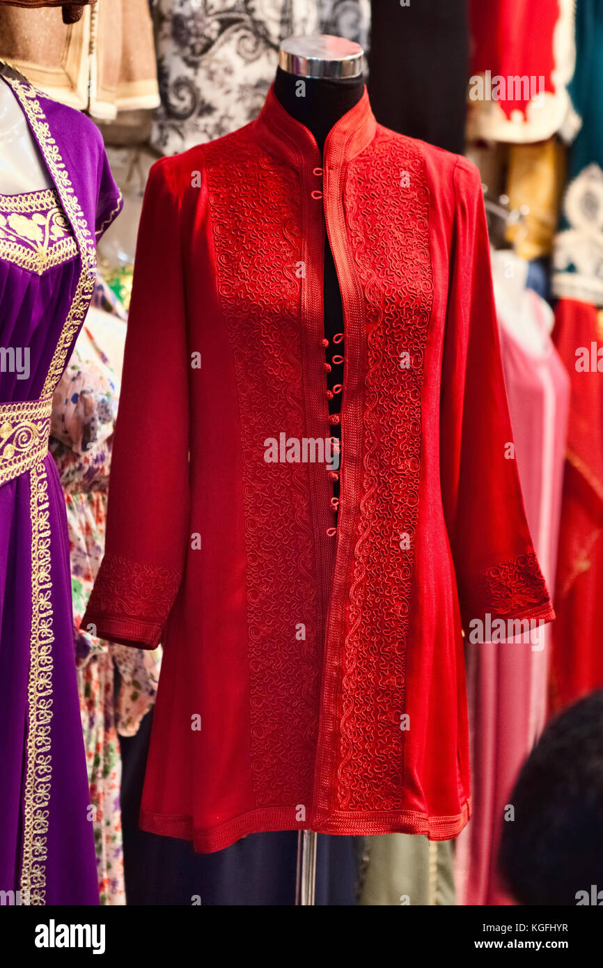 Djellaba - traditional long, loose-fitting female’s outer robe, for sailing on market in Marrakesh Stock Photo