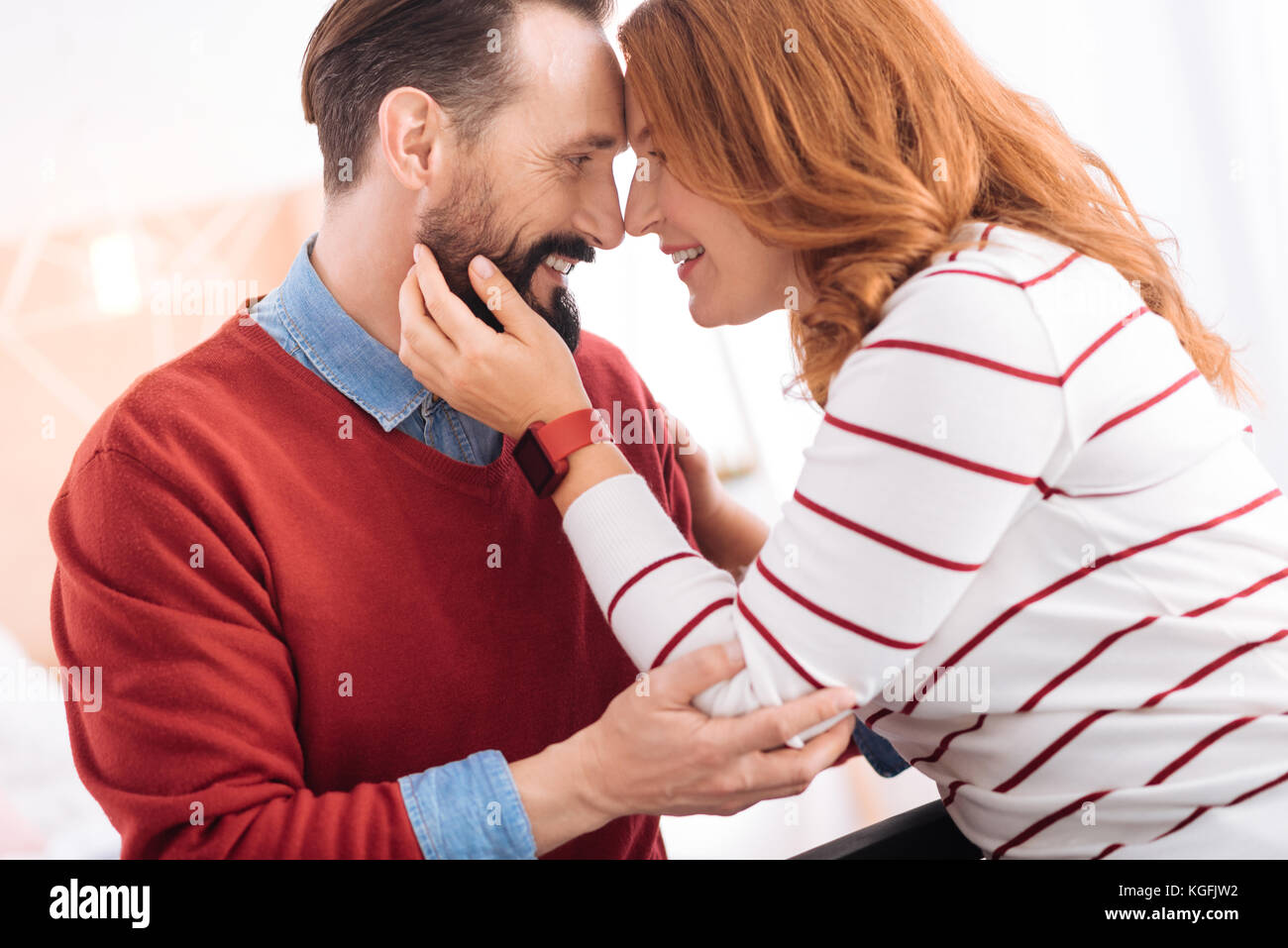 Happy man and woman hugging each other Stock Photo - Alamy